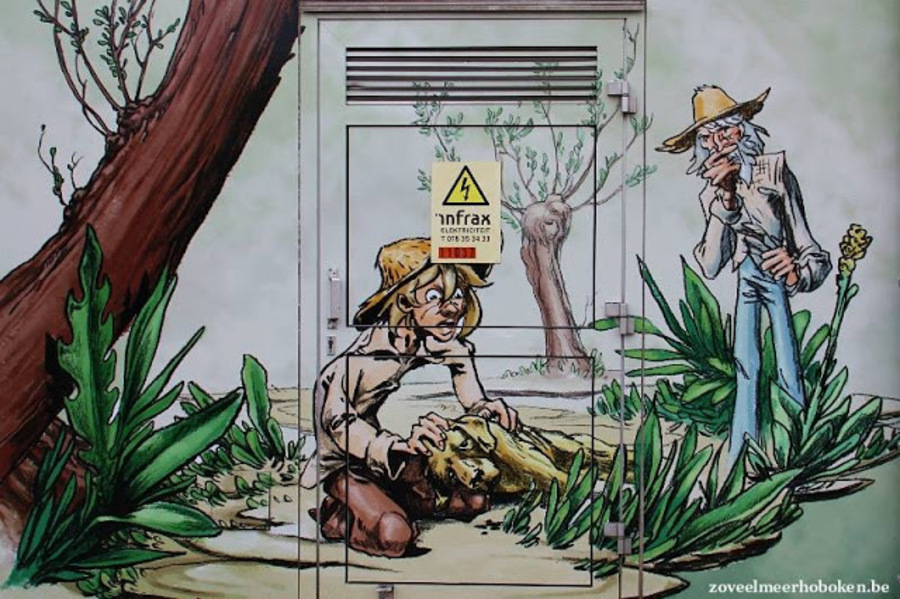 Nutskast met tekening van Nello en zijn grootvader die kennismaken met Patrasche, een zieke hond aan de kant van de weg