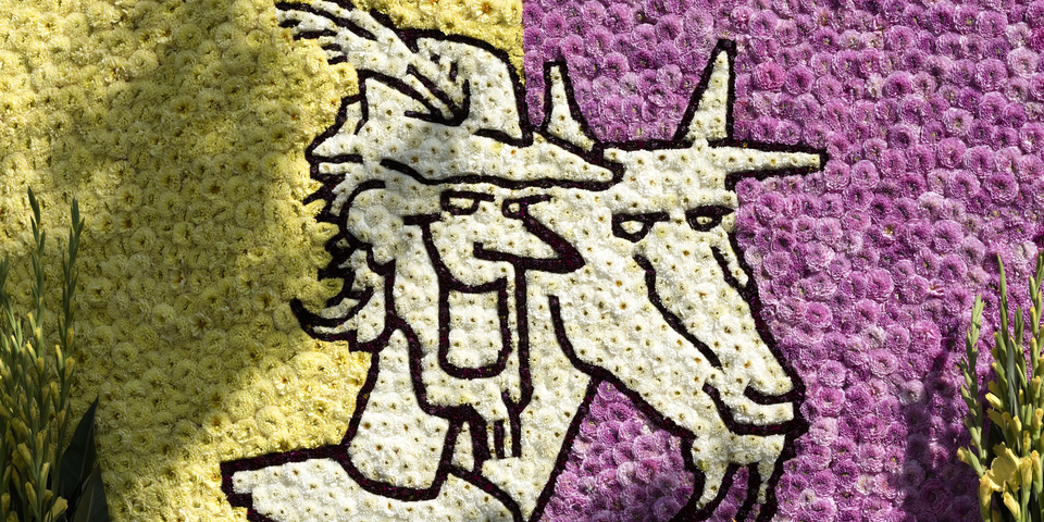 Bloemenuitvoering van het logo van de Geitestoet: de hoofden van Lange Wapper en een geit